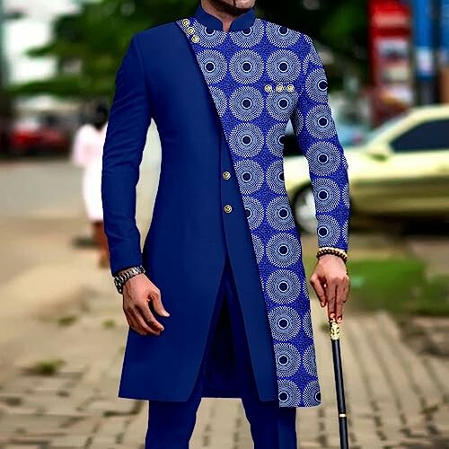 Man wearing a stylish blue ethnic outfit with patterned design.