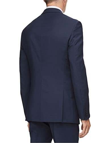 Back view of a person wearing a navy blue suit